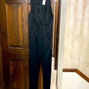 2X black jumpsuit with silver rings